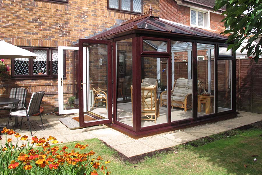 Dual dark woodgrain uPVC Elizabethan conservatory