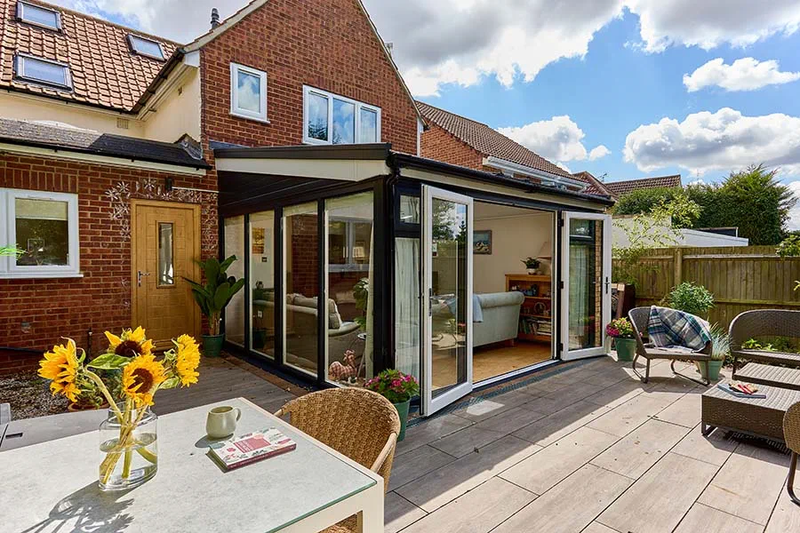 Dual anthracite grey extension with replica tile roof and French doors