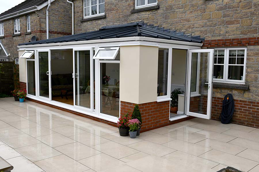 Solid panel roof extension with sliding patio doors