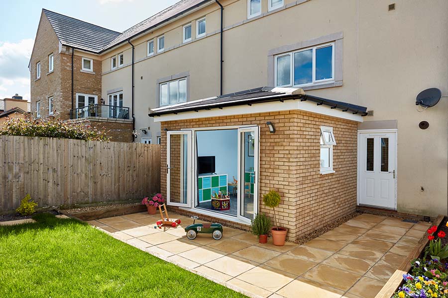 Traditional tiled extension with white uPVC French doors