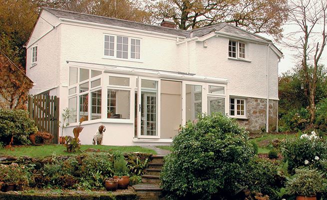 uPVC lean to conservatory in White Knight with shaped casement windows on rendered home from the Anglian conservatory range