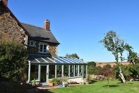 Dual sage green uPVC L shaped conservatory whole house