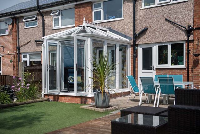 Dual cream small traditional orangery with solarroof