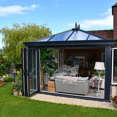 Modern anthracite grey Orangery with aluminium bifold doors on two sides
