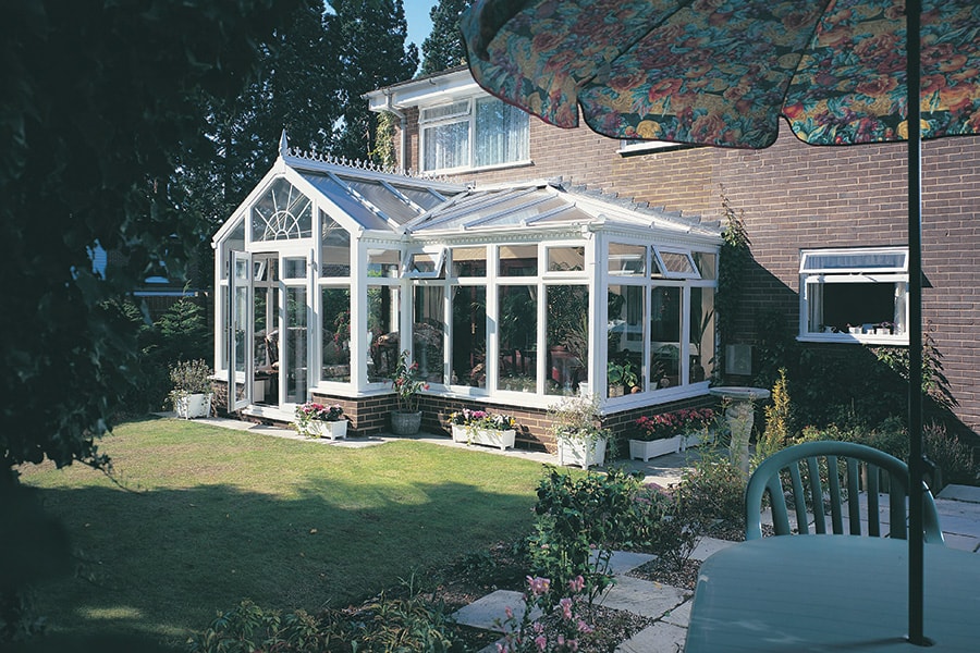 White uPVC harmony P-shaped conservatory with open windows