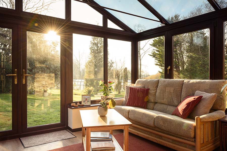 Dark woodgrain uPVC regency conservatory with French doors interior