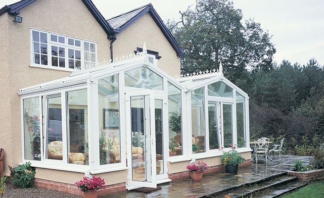 Large White UPVC Regency conservatory with tilt and turn windows and French doors from the Anglian classic conservatory range
