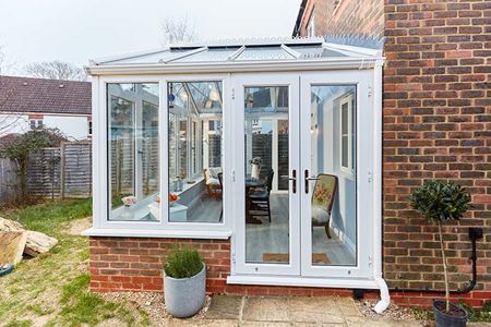 White uPVC regency concervatory with French doors front view
