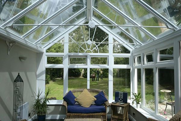 Regency conservatory in White UPVC with shaped casement windows and side hung opening window from the Anglian conservatories range