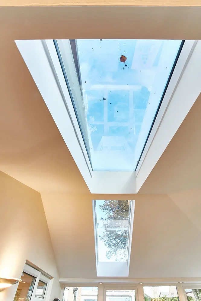Close up interior angled  view of glazed glass panels on a solid roof conservatory from the Anglian solid conservatory roof range