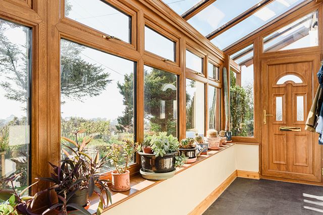 Golden oak uPVC Veranda conservatory with glass roof