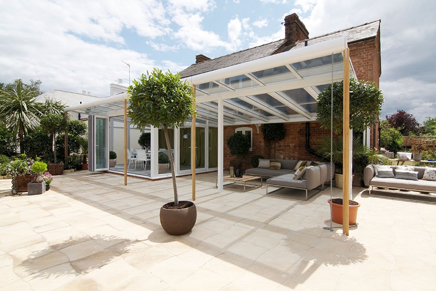 White PVCU veranda conservatory with outdoor furniture