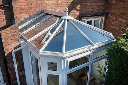 White uPVC Victorian conservatory with glass roof close up