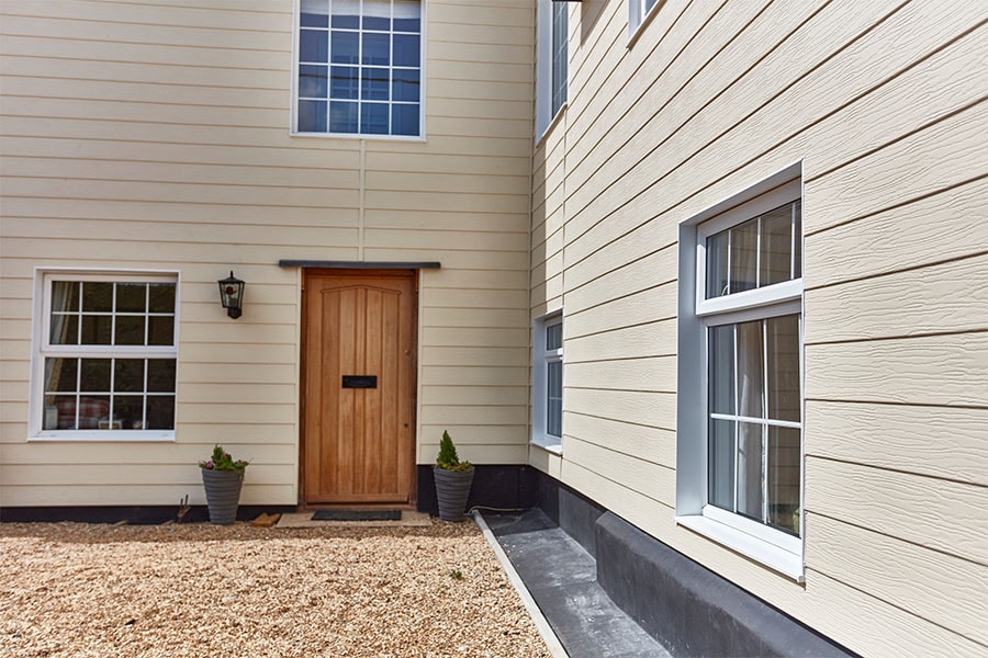 White uPVC Embossed feather cladding whole house