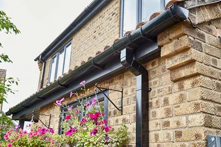 Black uPVC soffits and fascias guttering with casement windows