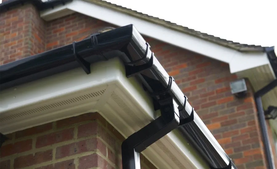 Anglian white fascia board and uPVC black guttering Anglian Home UK