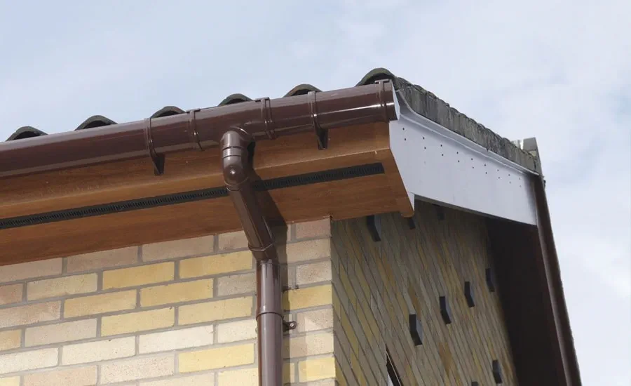 Golden Oak brown fascia board and upvc guttering from Anglian Home UK