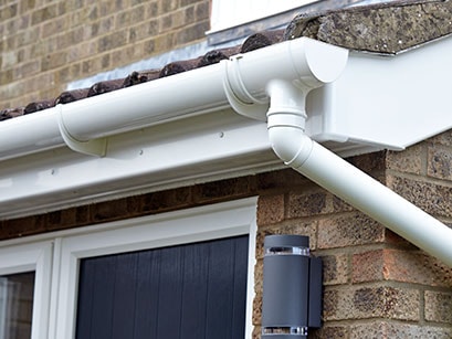 Anglian white guttering and downpipes made of uPVC