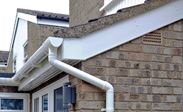 Whole house rooftrim renovation including White uPVC guttering downpipes soffits and fascias