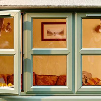 Anglian dual white and Sage Green coloured uPVC double glazed windows