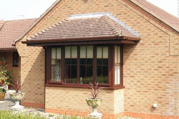 Anglian Brown window in UPVC square bay style