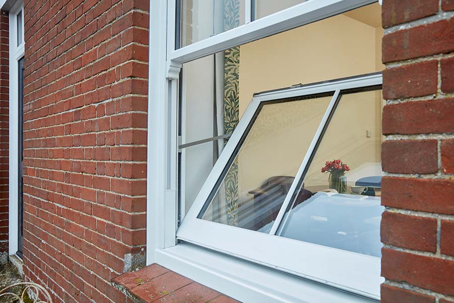 White tilting sash Victorian sash window close up