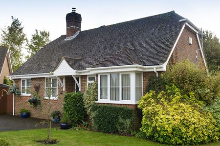 Bungalow with white uPVC square bay window