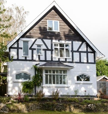 White uPVC square bay window and shaped windows from the Anglian window range