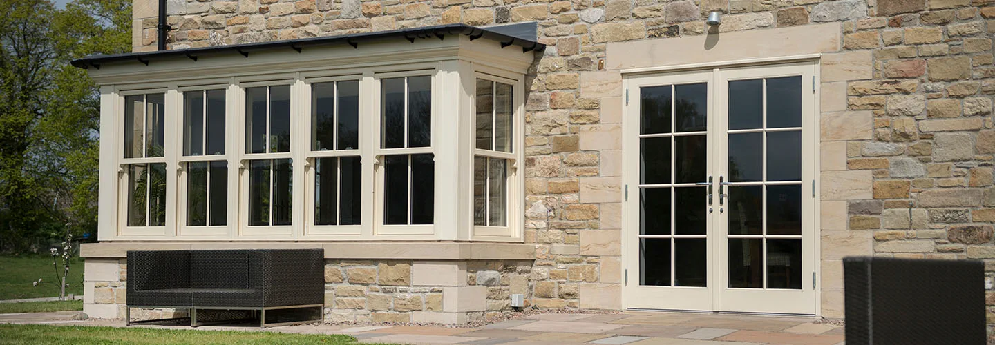 Wooden bay window with French doors banner