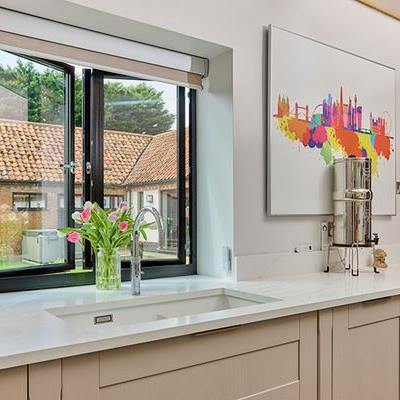 Black aluminium casement window in kitchen open