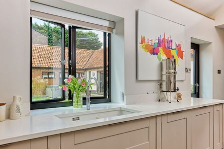 Black aluminium casement window in kitchen open