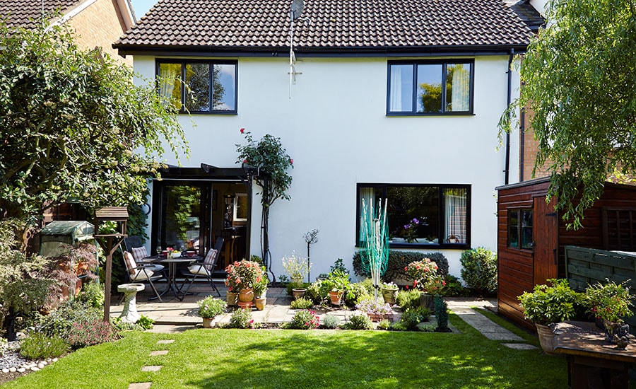 Whole house double glazed aluminium windows and patio door finished in Jet Black from the Anglian windows and doors range