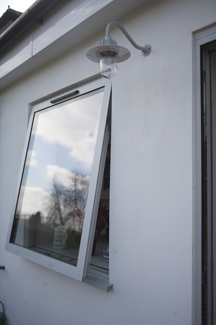 Top hung open white Aluminium casement window