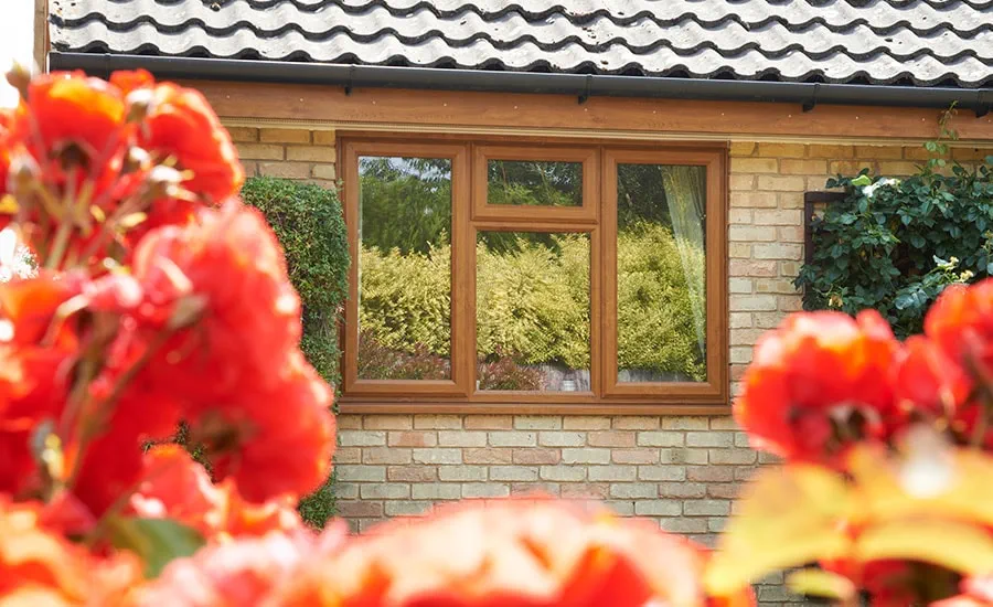 UPVC casement window with double glazing finished in Golden Oak woodgrain effect from Anglian Home Improvements