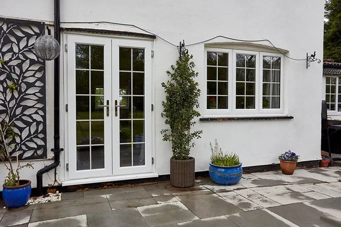 White uPVC casement window with georgian bars and door