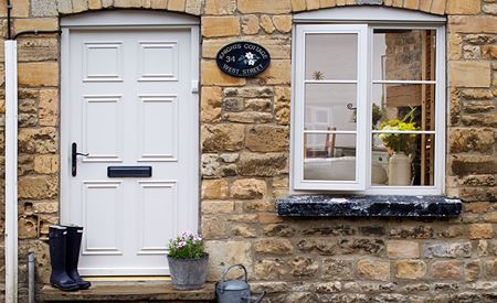 Timber windows and doors finished in white