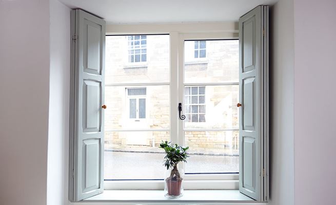 Side hung timber casement window in cottage style finished in White from the Anglian timber window range
