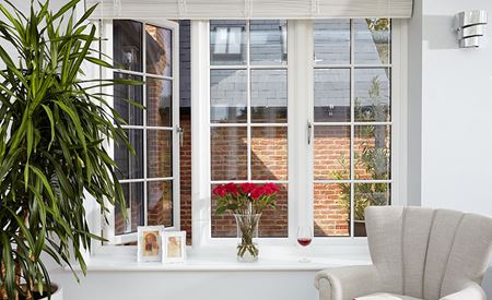 Traditional timber window featuring cottage bars and viewed from inside a living room