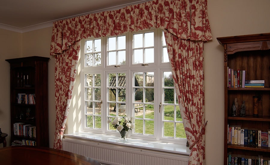White double glazed UPVC dining room window with cottage bars from the Anglian double glazing window range