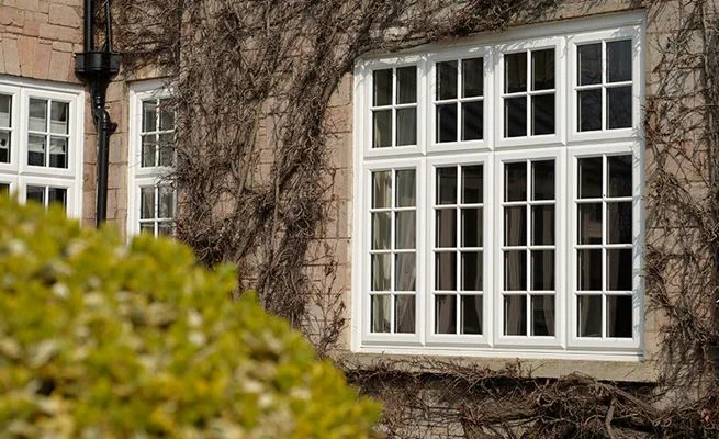 Traditional White Knight UPVC top hung casement windows with cottage bars from the Anglian UPVC windows range