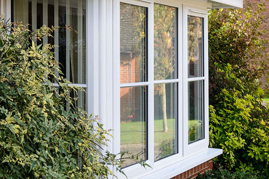 White UPVC bay window with cottage bars from the Anglian cottage windows range