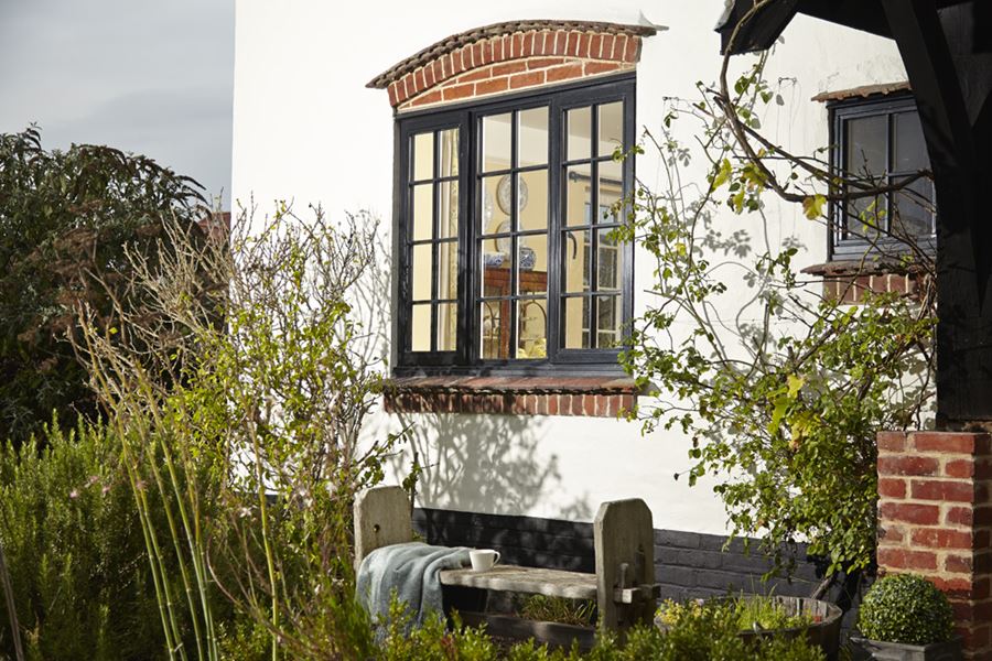 Timber window finished in black Cottage Bars