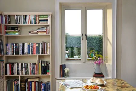 Kitchen/dining room featuring timber window with garden view