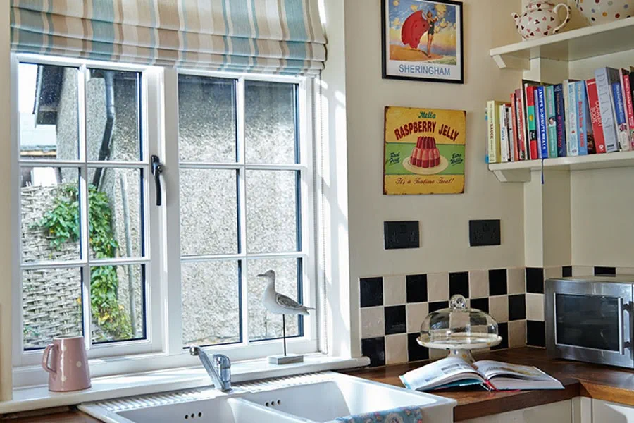 White wooden kitchen window with cottage bars from the Anglian cottage window range