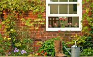 Single traditional white wooden sash window with double glazing and cottage bars from the Anglian sash windows range