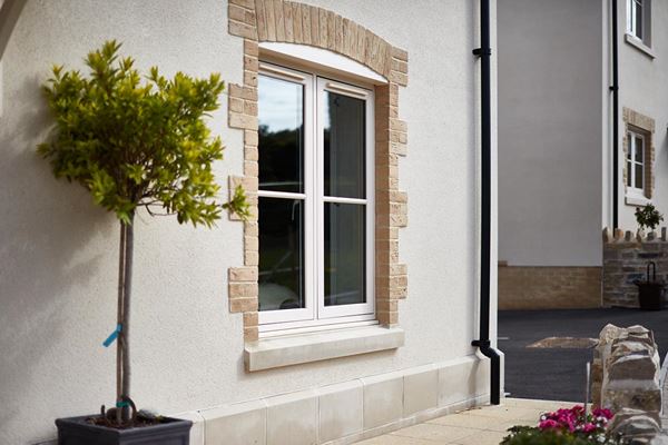 Side view of flush uPVC casement window finished in Cream from the Anglian flush window range