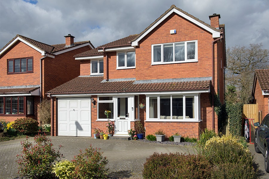 White uPVC casement windows with half glazed uPVC front door whole house