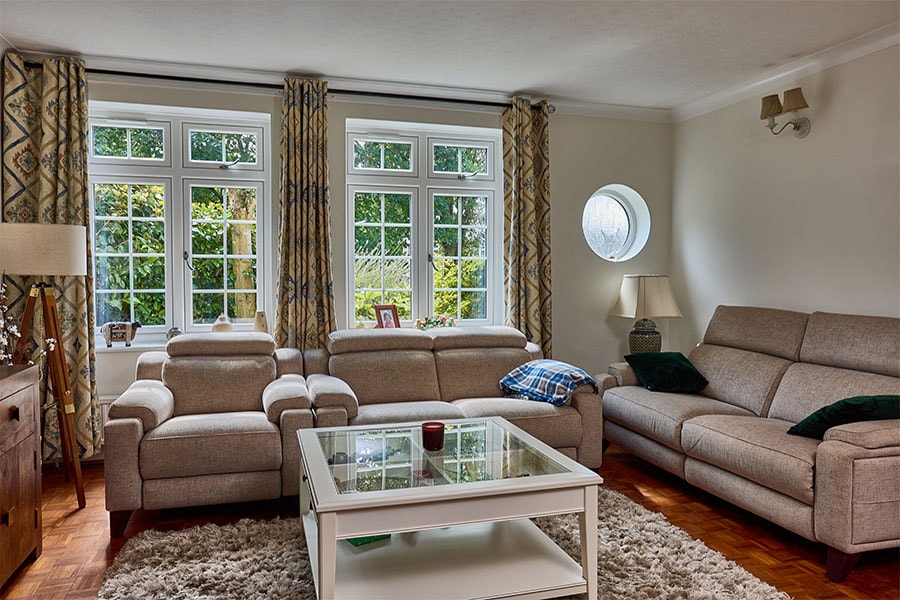 White uPVC Flush windows with Georgian insert bars duo with round window