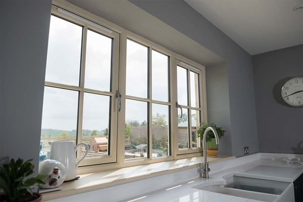 Wooden flush casement kitchen window in Cream with cottage bars from the Anglian flush window range