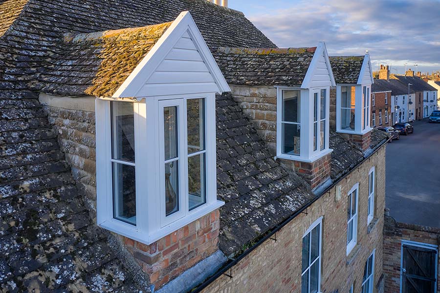 White wooden flush windows top floor view